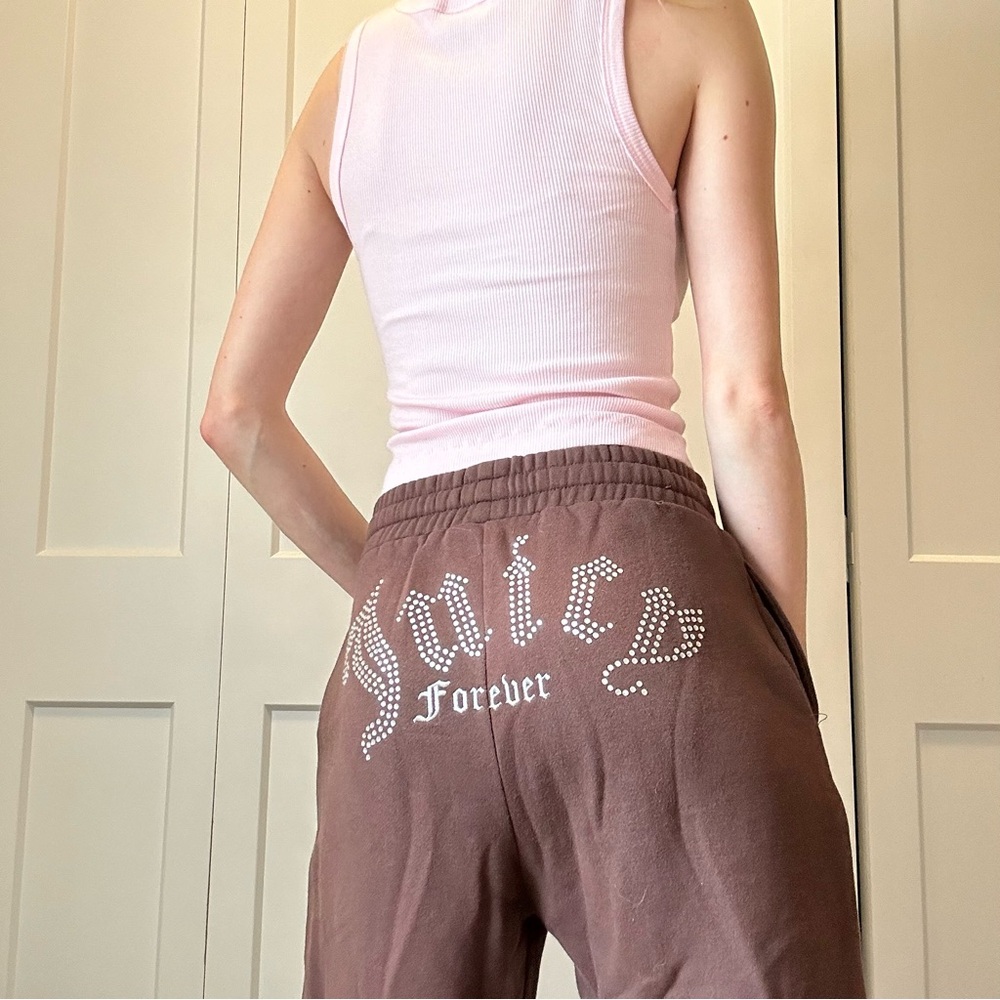 Brown, fleece joggers with bejeweled “Juicy Forever” lettering and tie waist. Xs